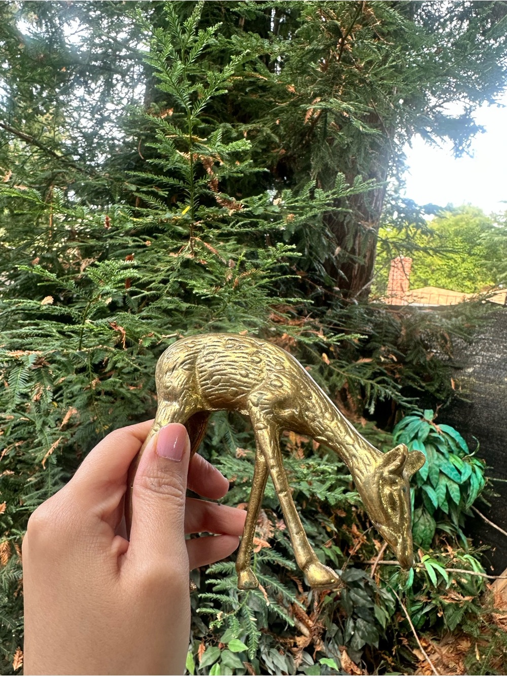 vintage mid-century small brass grazing deer figurine with a sweet lowered head